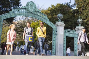 Students walking in front of Sather Gate.
